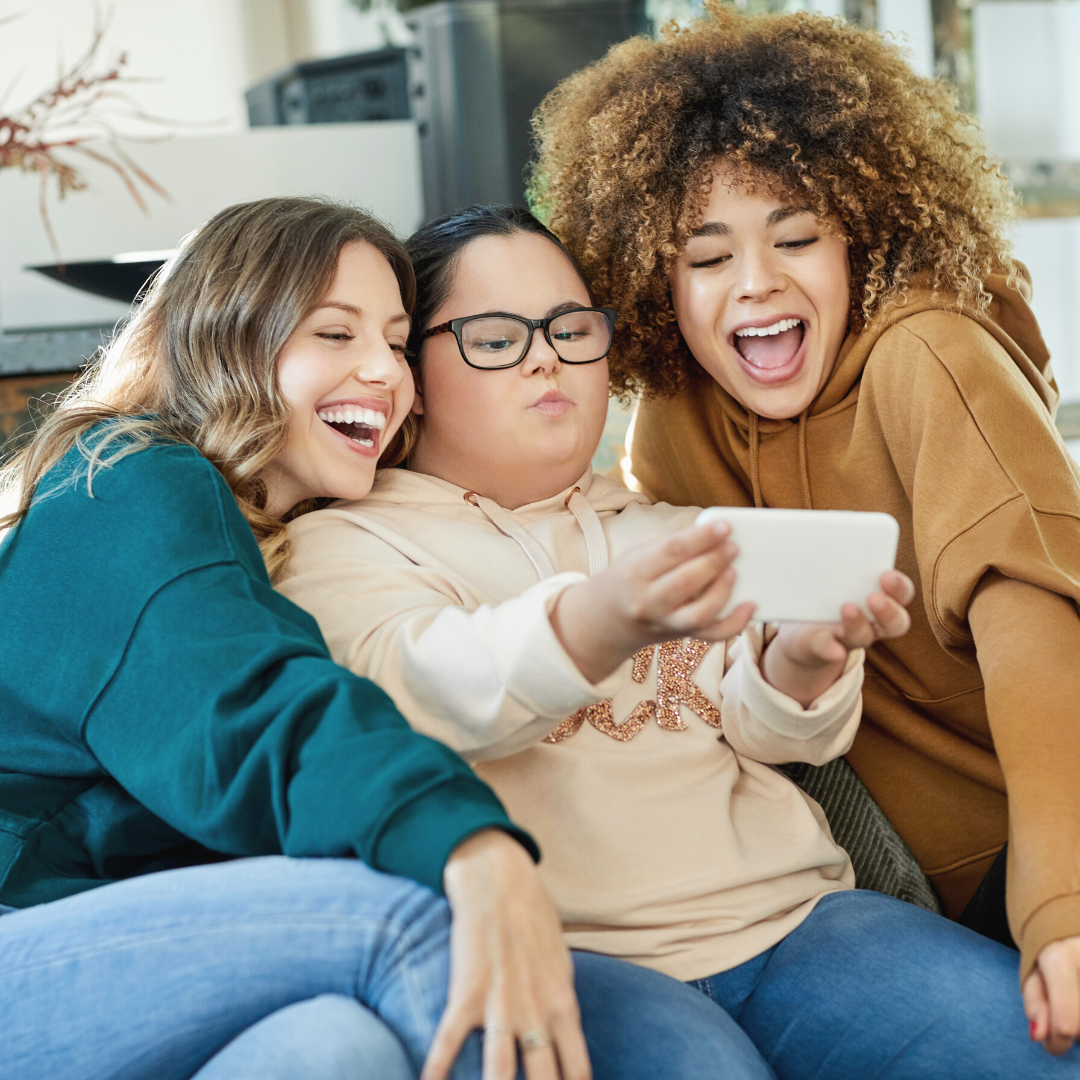 Friends smiling together, enjoying life with NDIS support
